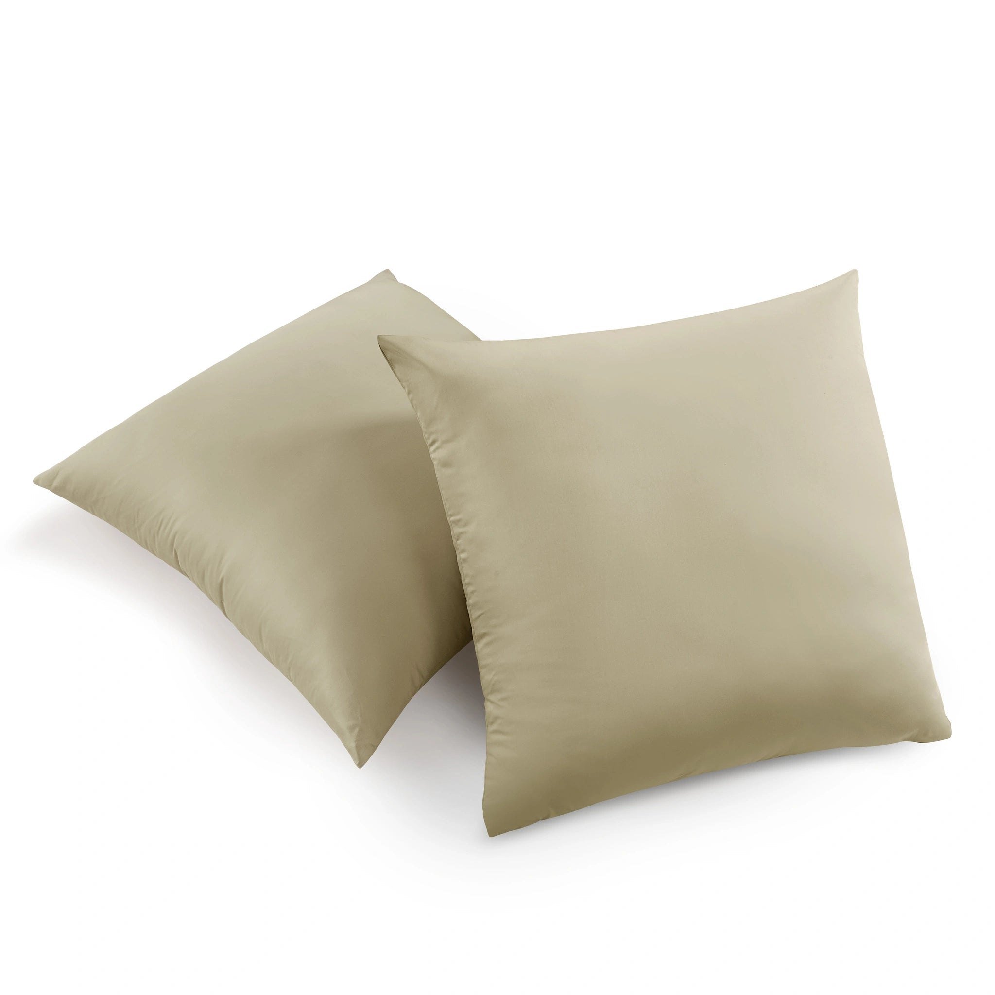 Two square throw pillows in a solid light beige color, arranged overlapping on a clean white background.