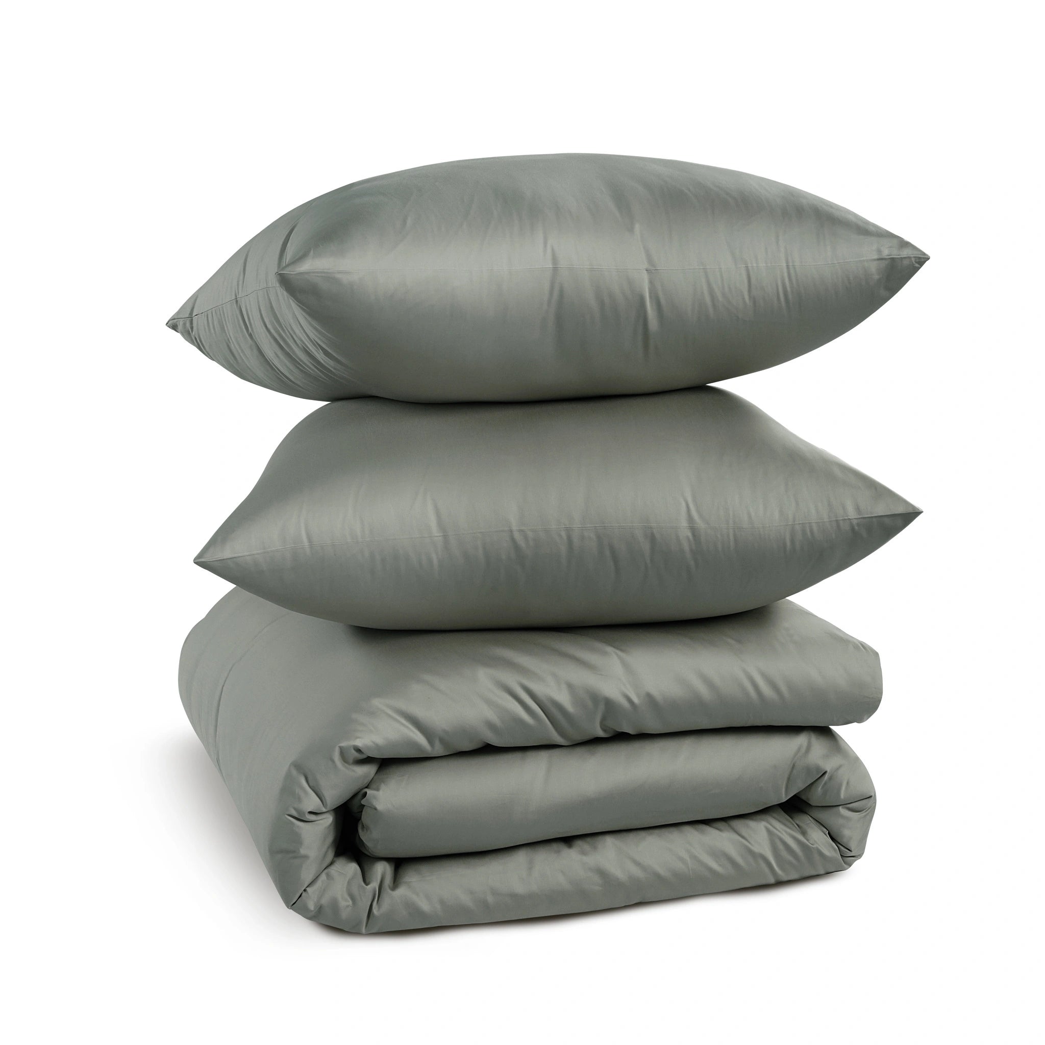 A stack of three gray bedding pieces, including two pillows and a folded comforter or duvet, photographed on a clean white background.