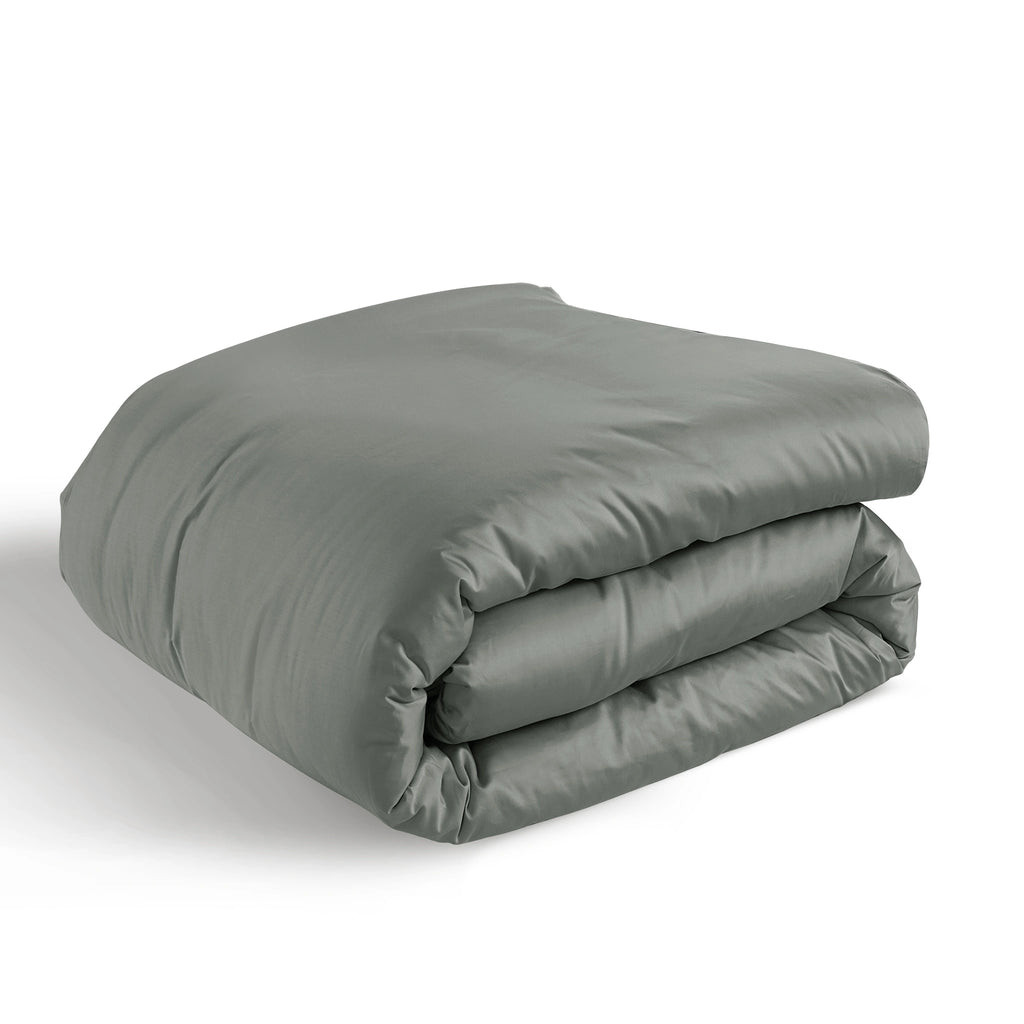 A folded gray comforter or duvet with visible quilting, photographed on a clean white background.