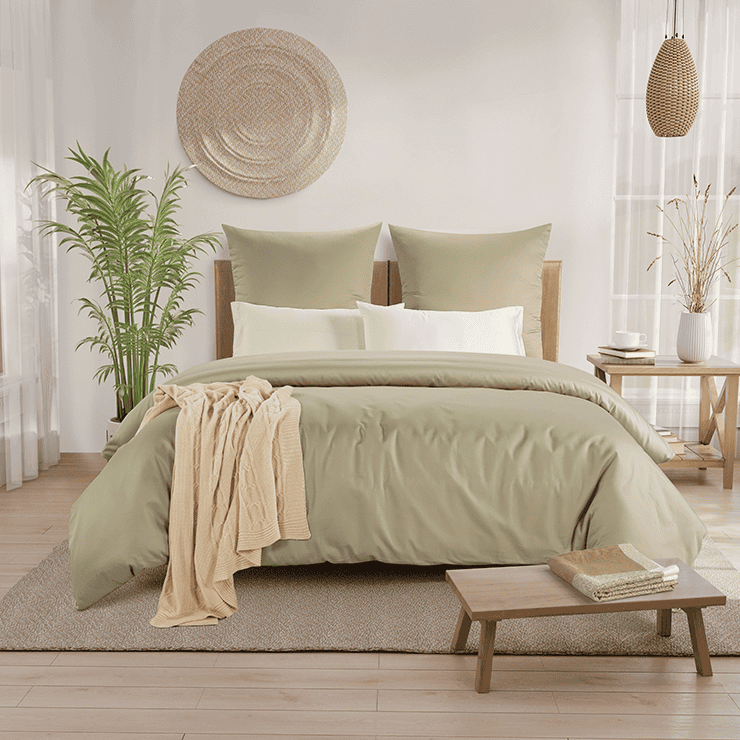 Minimalist bedroom with natural wooden furniture and plants which makes bedroom more sustainable.